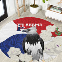 Round rug with harpy eagle center, red-and-blue flag style and white flowered mola pattern