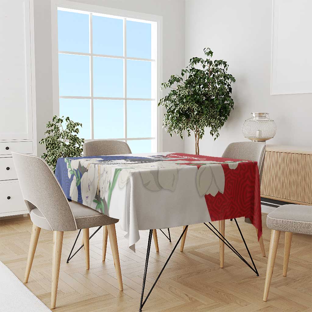 Harpy eagle tablecloth in red and blue mola-style pattern on dining table