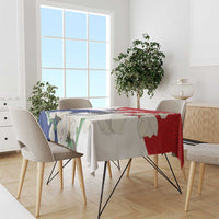 Harpy eagle tablecloth in red and blue mola-style pattern on dining table