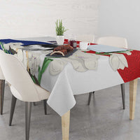 Red, blue, and white harpy eagle tablecloth with mola-style pattern draped