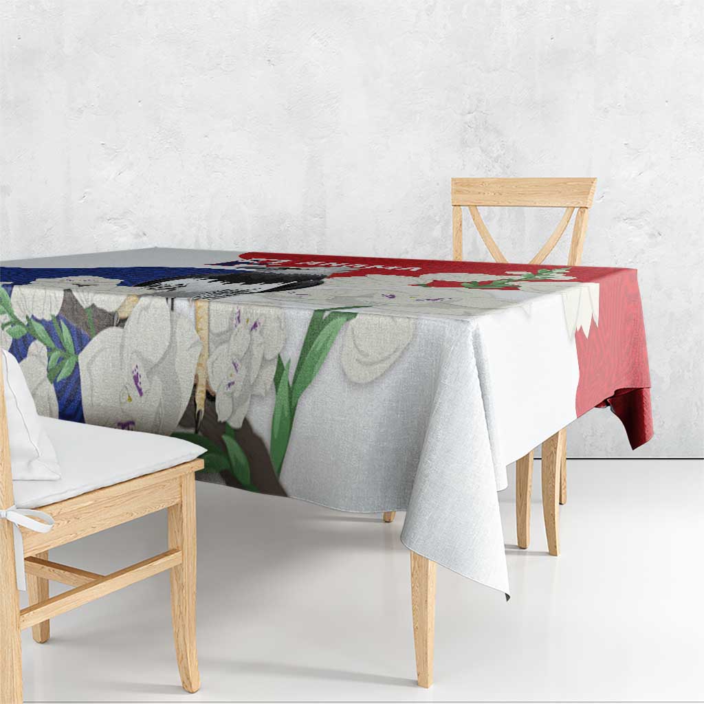 Harpy eagle tablecloth with red and blue mola-style print, draped over bench table