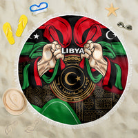 Round Libya beach blanket with white fringe, central “LIBYA” emblem, flag pattern and stars