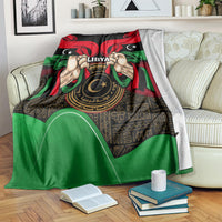 Libya flag-style blanket draped over couch with hands holding 'LIBYA' emblem
