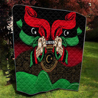 Libya flag-style quilt with black background, red wing shapes, and green bottom emblem.