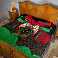 Libya flag-style quilt covering bed with red, black, green colors and hands emblem.