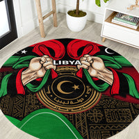 Round black rug with LIBYA emblem, raised hands, red and green ribbon pattern