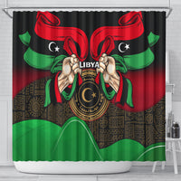 Black shower curtain with Libya flag graphic, centered emblem, red wings and green ribbons