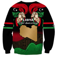 Black unisex sweatshirt with Libya 72nd anniversary print, map silhouette and raised fists