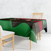 Libya flag African patterned tablecloth draped on table, green red and black geometric motif