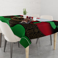 Libya flag patterned tablecloth with green and red panels, black decorative center, on table