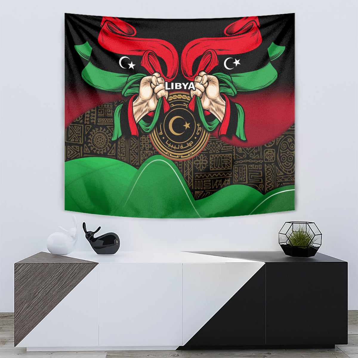 Wall tapestry with black base, Libya text on central emblem, red wings and green ribbon details.