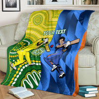 Custom cricket blanket on a couch, yellow-green left panel and blue right panel with orange trim