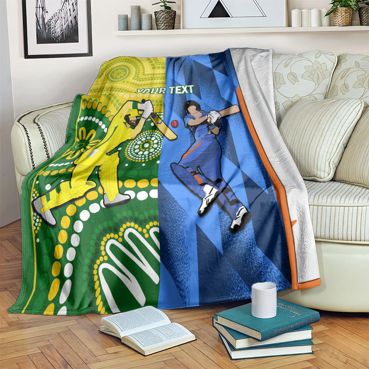 Custom cricket blanket spread on a couch, yellow and blue panels with orange border and sports icons