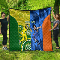 Quilt blanket showing green, yellow, blue, and orange cricket-themed artwork with quilted texture