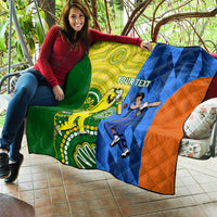 Cricket quilt blanket draped on couch with green, yellow, blue, and orange player artwork