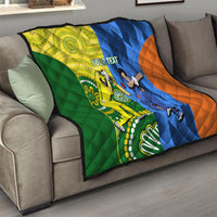 Cricket quilt blanket on gray sofa with green, yellow, blue, and orange panels and “YOUR TEXT”