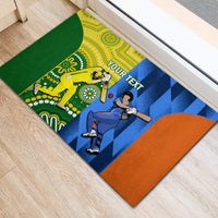 Cricket rubber doormat corner view with yellow and blue central graphics and orange edge