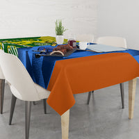Cricket-themed tablecloth on dining table, blue, green and orange