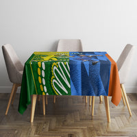Cricket-themed tablecloth with green, blue and orange panels on dining table