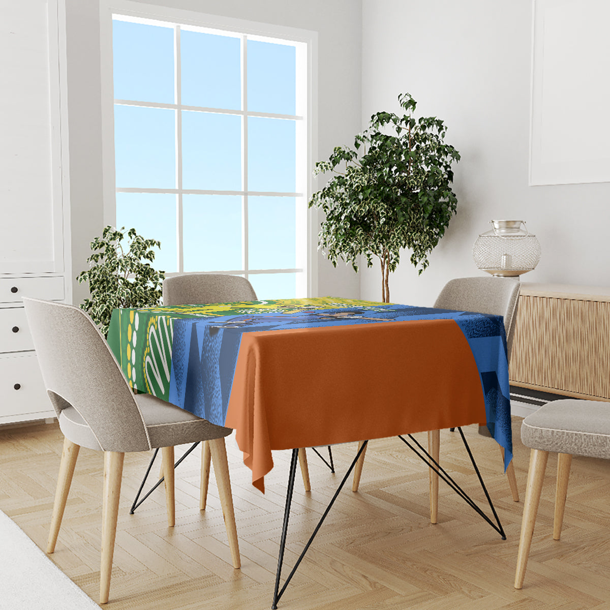 Cricket-themed tablecloth on dining table, blue and orange drape with green side