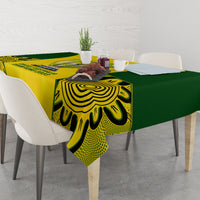Yellow and green tablecloth on dining table with trophy-style center print and side patterns