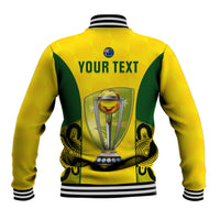 Yellow back of baseball jacket with green graphic, trophy badge, striped ribbed hem