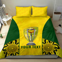 Yellow and green bedding set with two pillows and central trophy with "YOUR TEXT" text