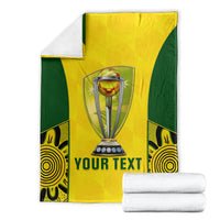 Folded yellow and green cricket blanket with trophy graphic and 'YOUR TEXT' center print