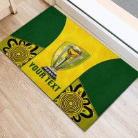 Green and yellow rubber doormat with trophy graphic and 'YOUR TEXT' banner, angled