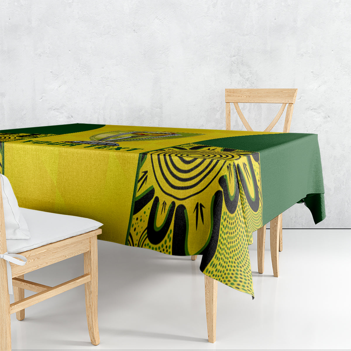 Yellow and green tablecloth draped on table, flame-pattern design with trophy center
