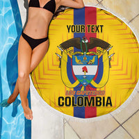 Yellow Colombia beach blanket with fringe, crest and custom text beside pool