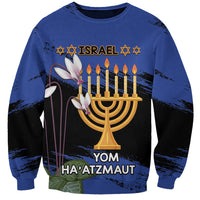 Blue crewneck sweatshirt with menorah graphic and Hebrew/Israel text