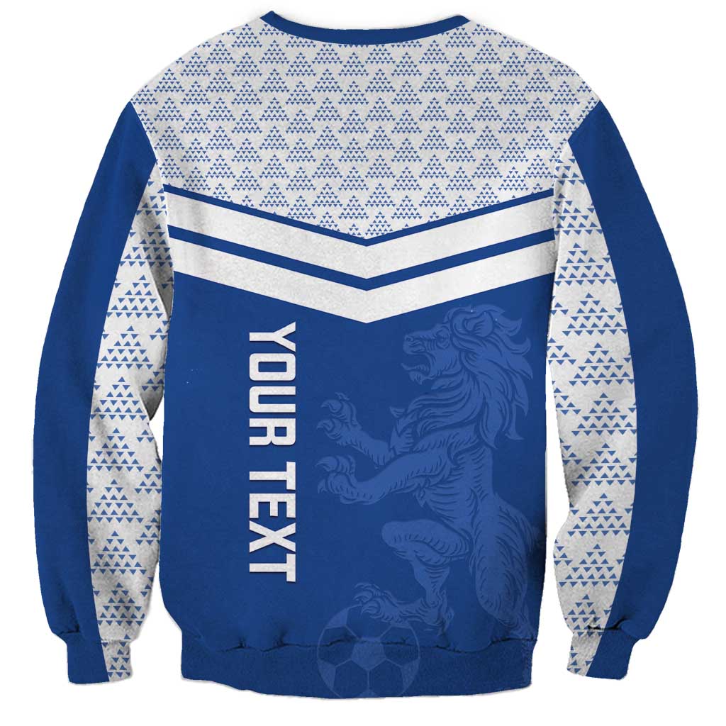 Blue crewneck sweatshirt with chevron stripes, white sleeve pattern, and lion graphic