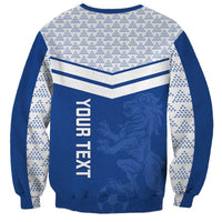 Blue crewneck sweatshirt with chevron stripes, white sleeve pattern, and lion graphic