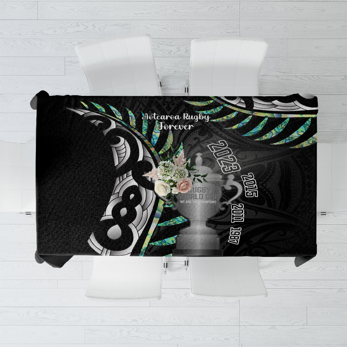 Black rugby tablecloth with teal silver fern and sports trophy-style graphic