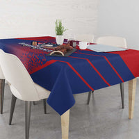 Red and navy baseball tablecloth with diagonal stripes and 'DOMINICANA' crest, corner drape.