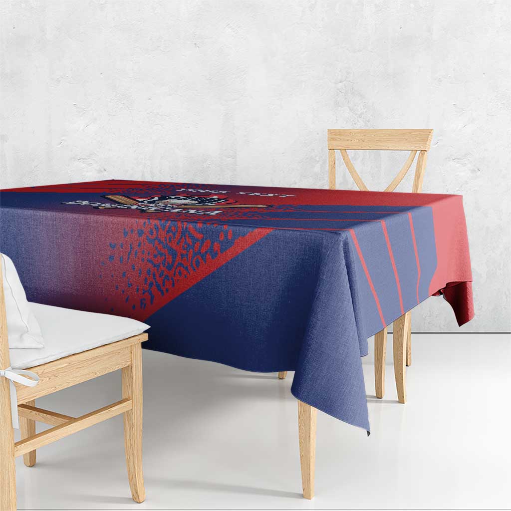 Red and navy baseball tablecloth with diagonal stripes and 'DOMINICANA' graphic, hanging edge.