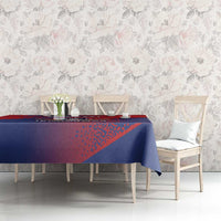 Red and navy baseball tablecloth with diagonal stripes and 'DOMINICANA' crest behind chairs.