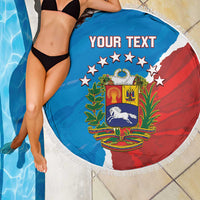 Round beach blanket with fringe, blue-red crest print and 'YOUR TEXT' lettering