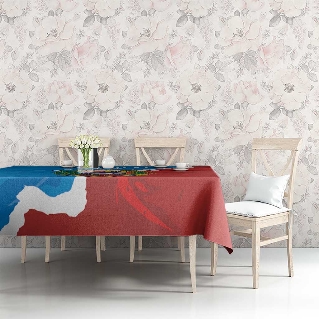 Blue and red Venezuela flag style tablecloth on a dining table in front of chairs
