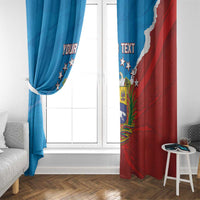 Two-tone blue and red Venezuela curtains drawn at a white-framed window