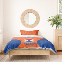 Orange and blue Netherlands bedding set with duvet and pillows featuring “YOUR TEXT” crest