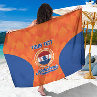 Orange-blue sarong close-up with YOUR TEXT and Netherlands circular crest
