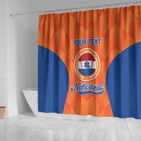 Hanging orange and blue Netherlands-themed baseball shower curtain with 'YOUR TEXT' center print