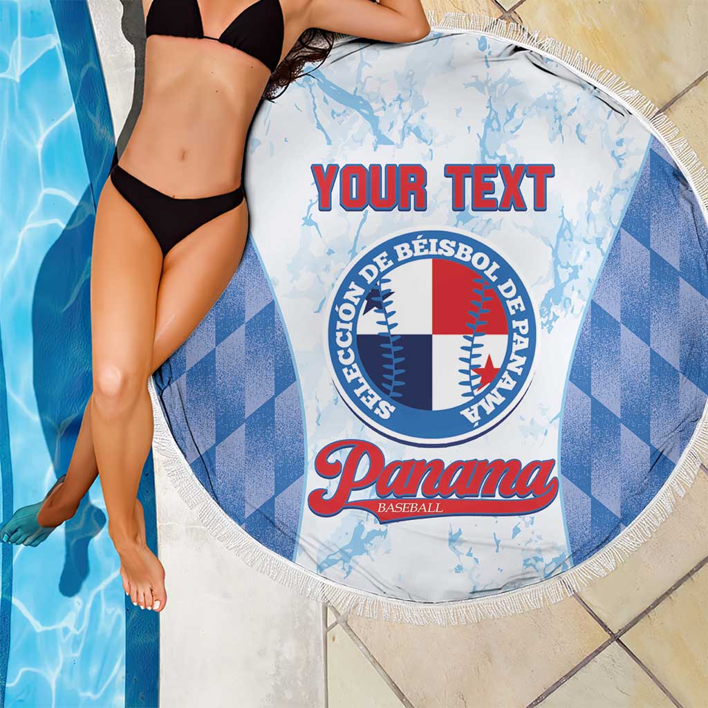 Round beach blanket with blue check pattern and central baseball emblem, white fringe