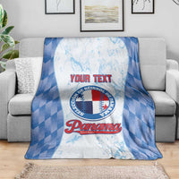 Custom baseball blanket with blue check border and Panama logo, spread on sofa