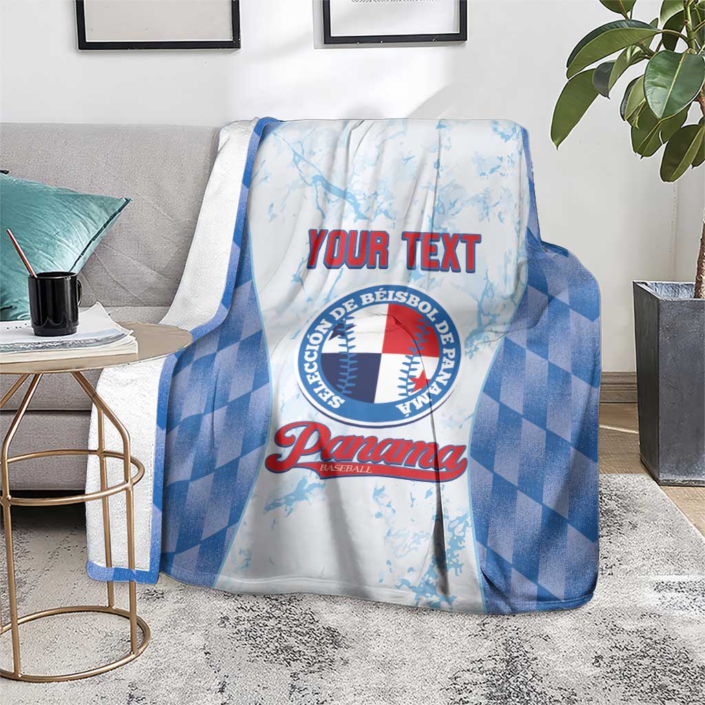 Custom baseball blanket with blue check pattern and Panama logo, draped over armchair