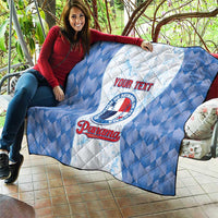 Blue and white quilt blanket with baseball logo and custom text, draped on sofa