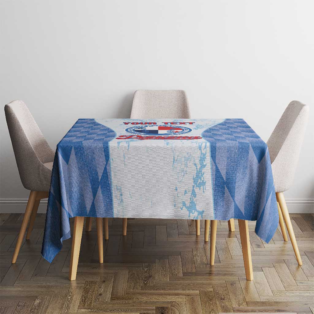 Square blue checker tablecloth with red-and-blue crest logo at center