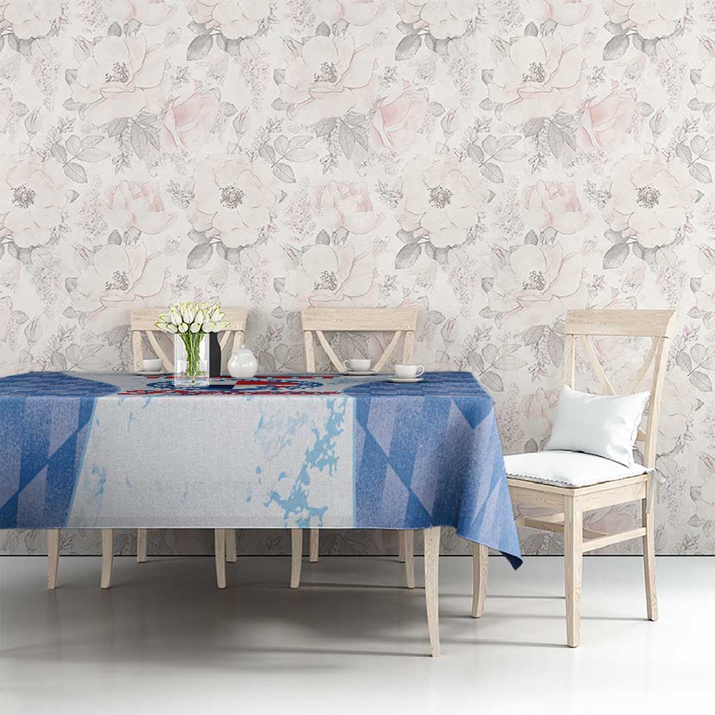 Rectangular blue checker-pattern tablecloth with sports-themed center design